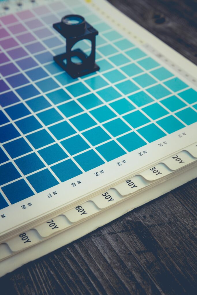 Papier A color palette with a magnifying glass tool, ideal for design and printing work.